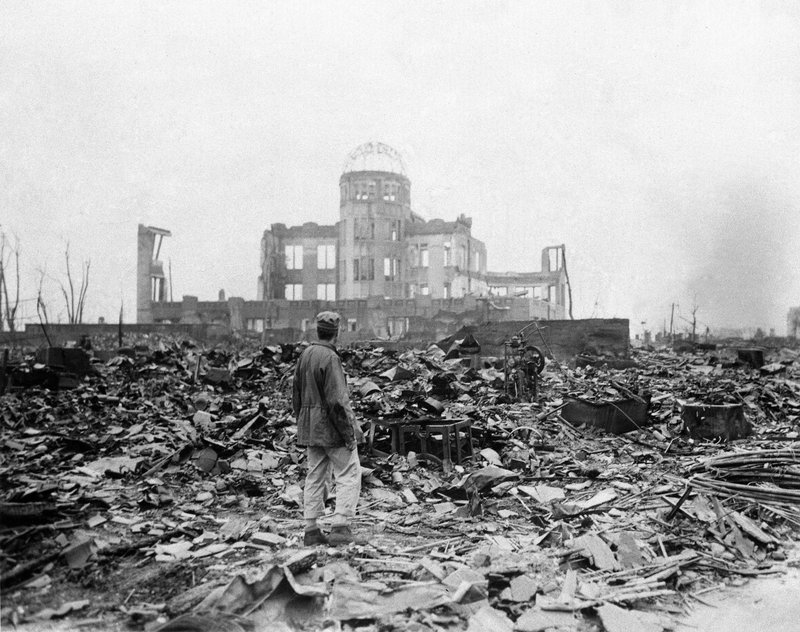 In this Sept. 8, 1945, file photo, an allied correspondent stands in front of a building that once was a movie theater in Hiroshima, Japan, a month after the first atomic bomb ever used in warfare was dropped by the U.S. on Aug. 6, 1945. 
