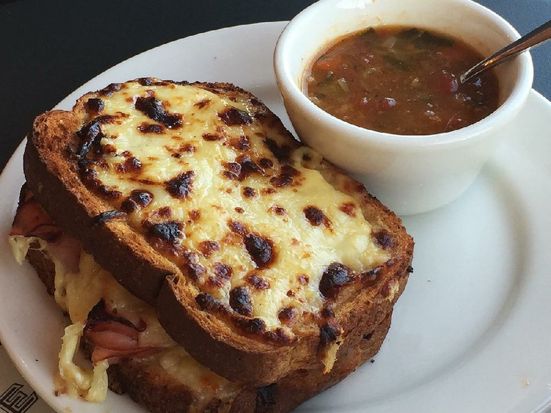 The Croque Monsieur, pictured here with a cup of White Bean & Vegetable Soup, is a signature sandwich at La Madeleine Country French Cafe in Little Rock. 