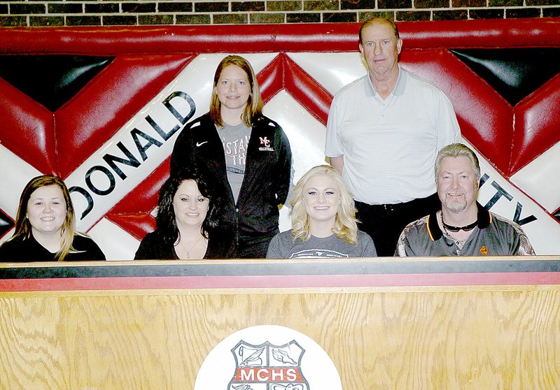 Photo by Rick Peck McDonald County&#8217;s Brittney Stone signed a letter of intent on May 4 to play volleyball at Ozark Christian College in Joplin. Shown are: front row from left, Cameron Johnson, Tanya Stone, Brittney Stone and Todd Stone; and back row from left, Kacha Kuhn and Chris Lahm.