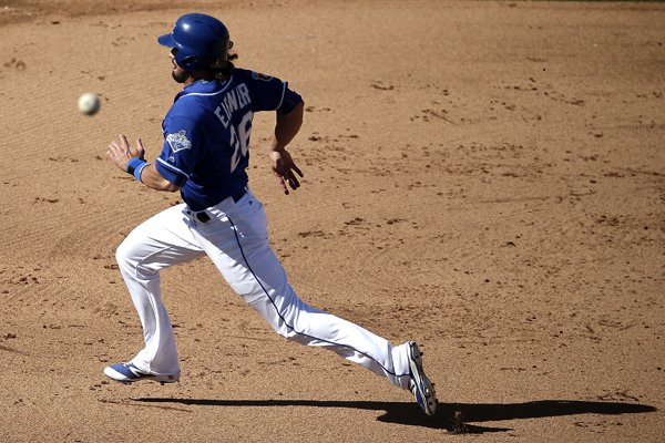 Kansas City Royals' Brett Eibner races the throw as he advances to third on a ground-out by Orlando Calixte during the seventh inning of a spring training baseball game against the Colorado Rockies on Tuesday, March 8, 2016, in Surprise, Ariz. (AP Photo/Charlie Riedel)
