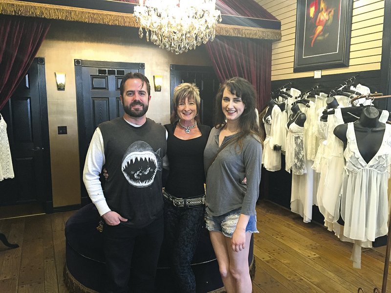 Director Cole Wimpee; Leslie Meeker, owner; and actress Maggie Ferran choose lingerie at The Fine Art of Romance.