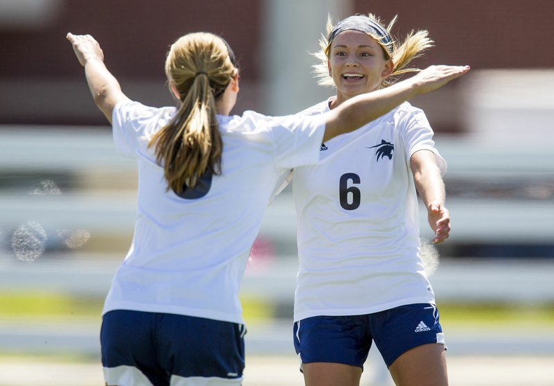 Elise Reina (left) celebrates with Alyssa Rocco, both Har-Ber seniors, following Rocco's second goal on Thursday, May 12, 2016, against North Little Rock at Springdale Har-Ber. Reina also scored in the 6-0 win.