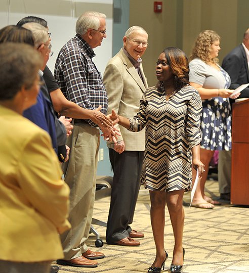 The Sentinel-Record/Mara Kuhn EDUCATIONAL FOUNDATION: Cassandra Hogan was congratulated by members of the Oaklawn Foundation board Thursday for receiving her third Oaklawn Foundation Scholarship. The awards were announced Thursday during a ceremony at National Park College.