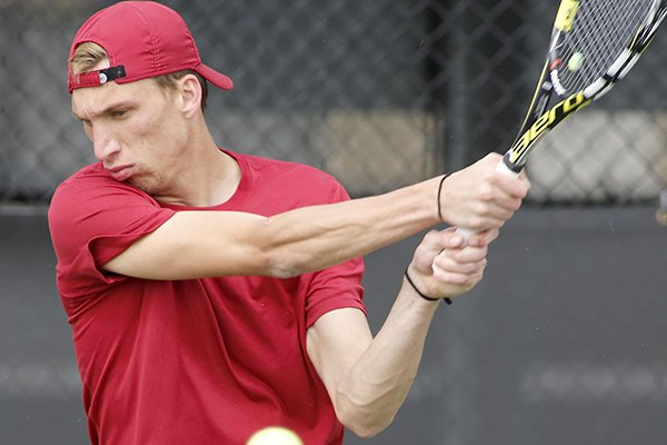 Arkansas' Mike Redlicki goes through practice Wednesday, March 16, 2016, at Dills Tennis Center in Fayetteville. 