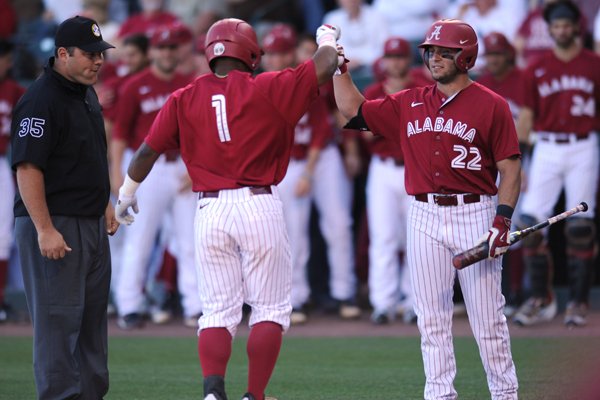 Alabama second baseman Cobie Vance (1) is congratulated by center fielder Georgie Salem (22) Friday, May 13, 2016, after hitting a solo home run against Arkansas during the first inning at Baum Stadium in Fayetteville.