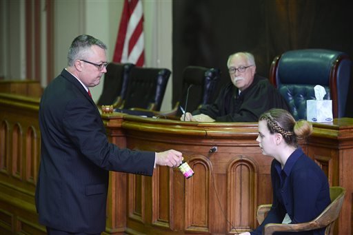 Muskingum County Prosecutor Mike Haddox shows Emile Weaver a bottle of black cohosh while questioning her on the stand in Zanesville, Ohio on Friday, May 13, 2016. Haddox alleged she took the supplement to cause a miscarriage.