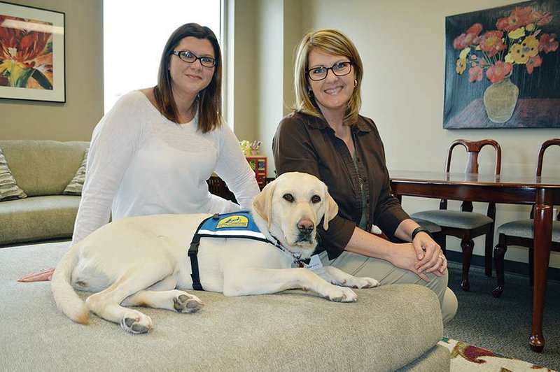 Fawn Borden, left, and Susan Bradshaw are handlers for Barb, a certified facility dog. The 20th Judicial District Prosecuting Attorney’s Office is the first in Arkansas to get a courthouse dog. Barb can be used to calm youth ages 18 and younger when they testify as witnesses or victims in criminal cases. Bradshaw is victim/witness coordinator and supervisor of the Victim Services Office, a part of the prosecutor’s office, and Borden is victim/witness coordinator.