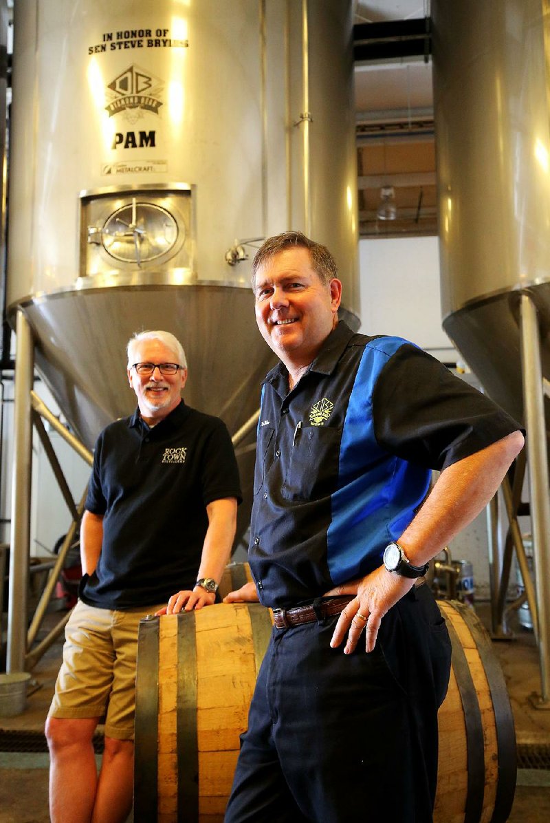 Rocktown Distillery founder Phil Brandon (left) and Russ Melton, president of Diamond Bear Brewing Co., are teaming up to create a new beer and single-malt whiskey.