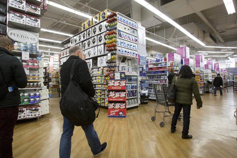 In this Tuesday, April 5, 2016, photo, customers shop at a Bed Bath &amp; Beyond, in New York. On Friday, May 13, 2016, the Commerce Department releases U.S. retail sales data for April. 