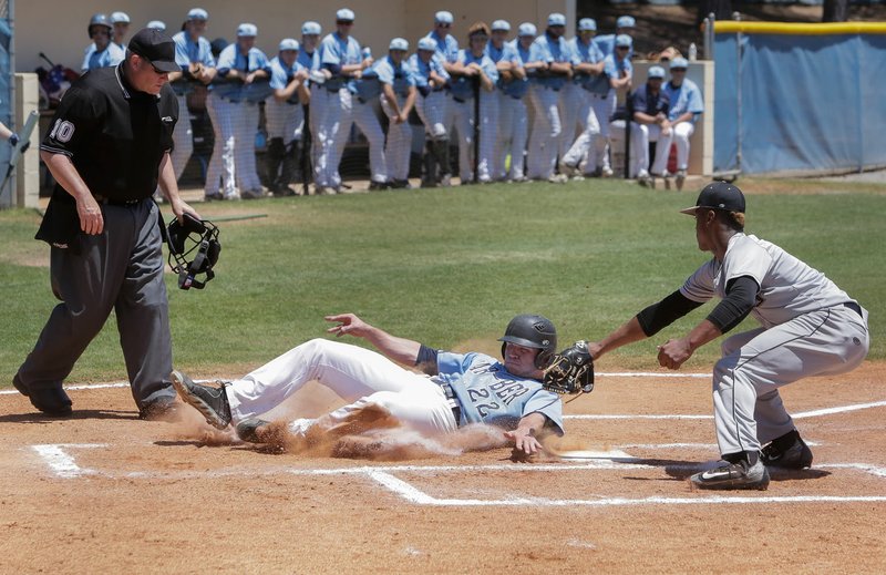 Springdale Har-Ber’s Caleb Kimbel slides safely into home plate under a tag attempt of Little Rock Central’s Errol Scott on Friday at the Class 7A state baseball tournament in North Little Rock. Har-Ber won 4-3. 