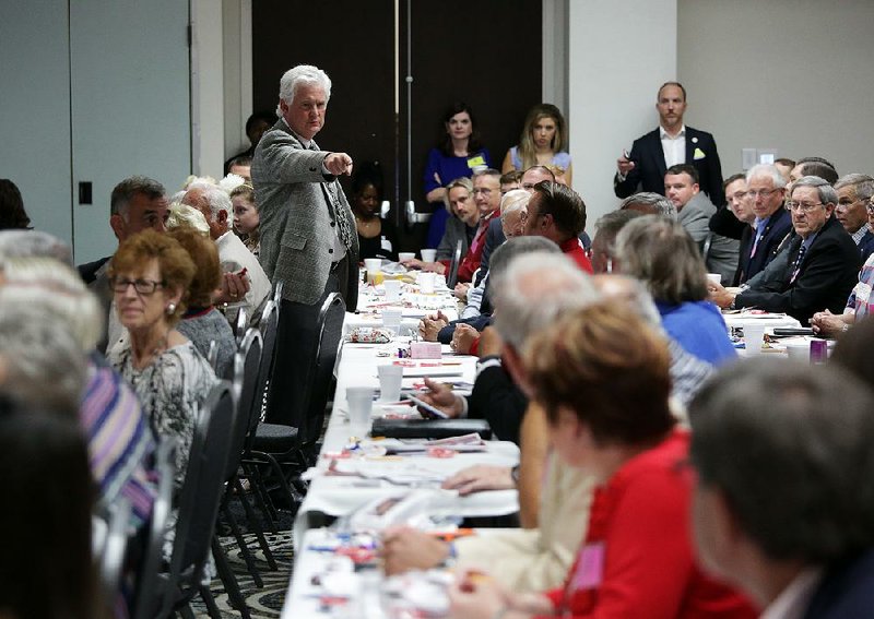 State Republican committee member Keith Gibson points to members Saturday in Hot Springs as they count out loud to determine the number of members eligible to vote on national convention delegates. 
