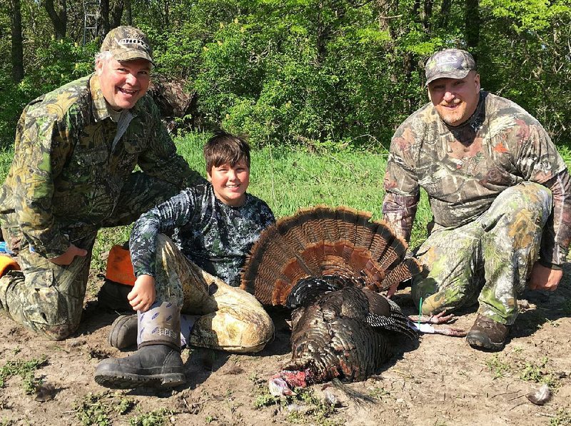 John Volpe (center) ended his turkey hunting “curse” May 6 when he bagged a mature eastern wild turkey with a 12-inch beard while hunting in northeastern Kansas with his father, Joe Volpe (left) and guide Scott Pipe.