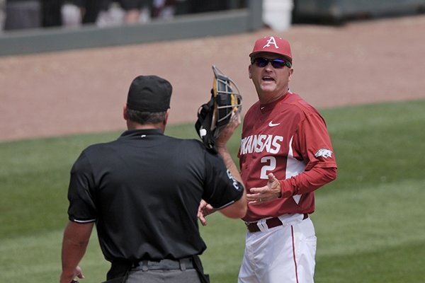 Arkansas coach Dave Van Horn speaks with home plate umpire Barry Chambers during a game against Alabama on Sunday, May 15, 2016, at Baum Stadium in Fayetteville. 