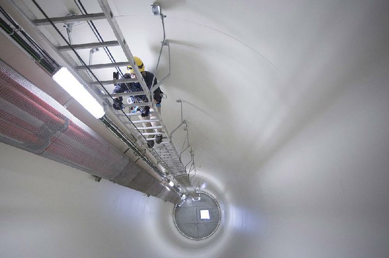 It’s a long climb up a ladder inside a turbine at the Colorado Highlands Wind Farm. Technicians go high in the turbine to lubricate cables and machinery.