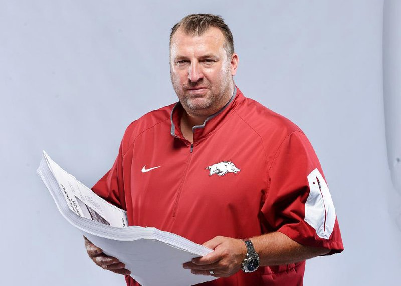 Coach Bret Bielema poses for a photo on Sunday Aug. 9, 2015 during Arkansas football media day at the Fred W. Smith Football Center in Fayetteville. 