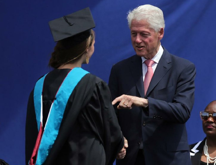 Former President Bill Clinton talks with graduate Berkeley Anderson during the 2016 Clinton School of Public Service commencement ceremony Sunday in Little Rock.