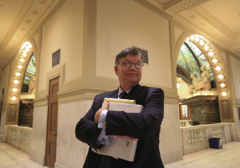 Little Rock City Attorney Tom Carpenter stands in the hall outside Pulaski County Circuit Judge Tim Fox’s courtroom after a hearing Monday about why a $10,000 sanction against the city of Little Rock was not paid on time.