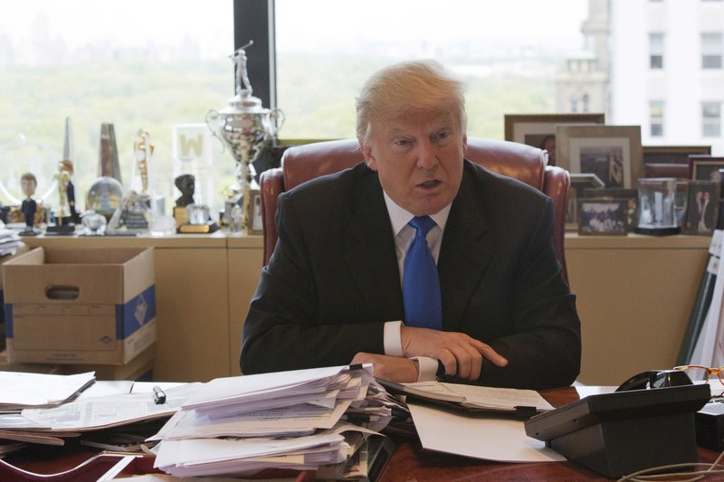 In this May 10, 2016 file photo, Republican presidential candidate Donald Trump speaks during an interview with The Associated Press in his office at Trump Tower in New York. 