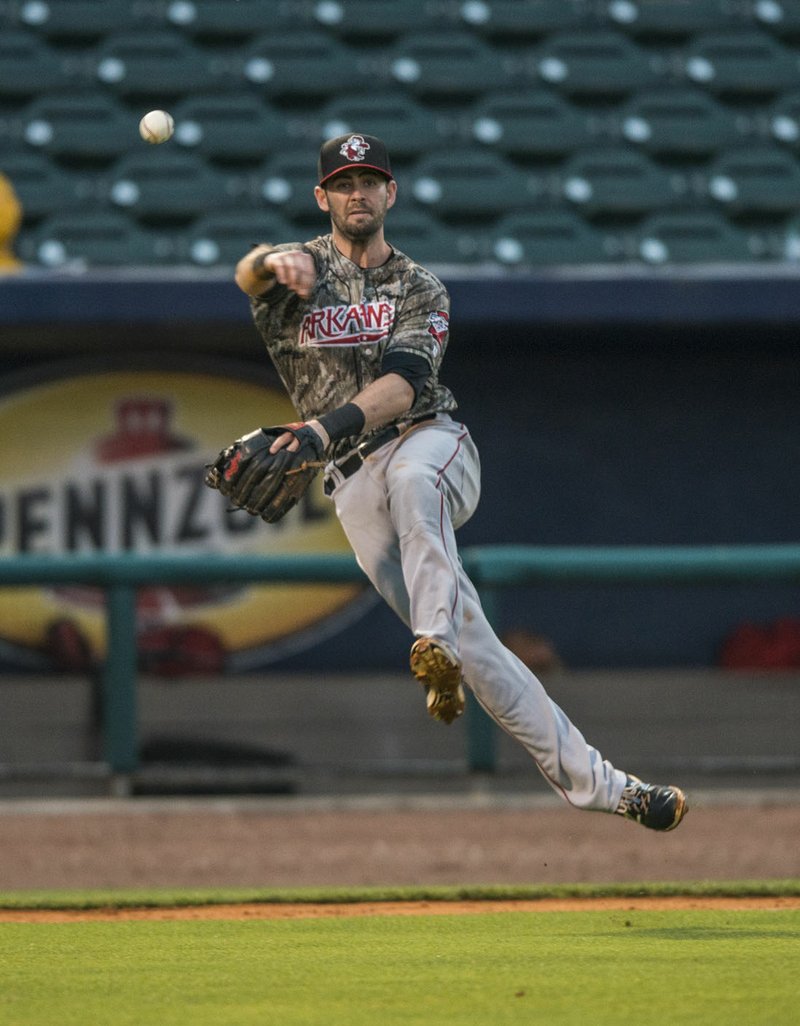 Andrew Daniel (4) of the Arkansas Travelers throws to first for the out against Northwest Arkansas Naturals Monday, May 16, 2016 at Arvest Ballpark in Springdale.