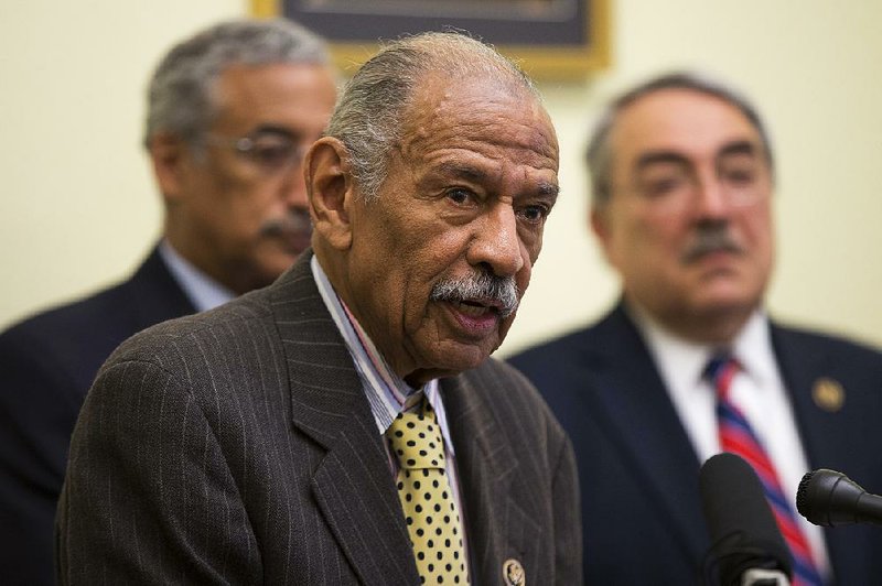 Rep. John Conyers, D-Mich., discusses the General Accounting Office report on public schools at a news conference Tuesday in Washington. Conyers was joined by Rep. Bobby Scott (left), D-Va., and Rep. G.K. Butterfield, D-N.C.