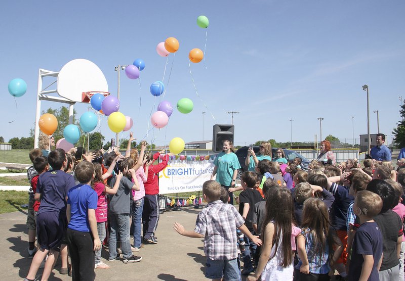 LYNN KUTTER ENTERPRISE-LEADER Bright Futures Lincoln celebrated its one-year birthday May 6. Here, students at Lincoln Elementary School cheer the release of colorful balloons. Bright Futures Lincoln has been described as a &quot;fantastic&quot; success for its first year.