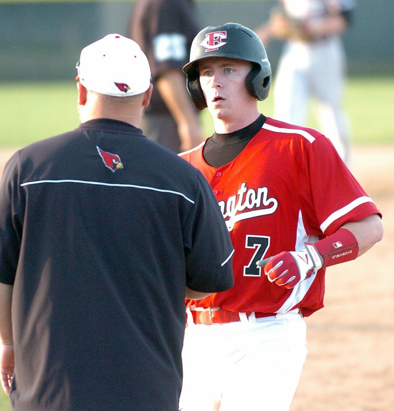 MIKE CAPSHAW ENTERPRISE-LEADER Caleb Reagan listens to instruction from first base coach Clint Scrivner after reaching on a single during a recent game. Reagan went 2 for 3 with a run during the Cardinals&#8217; season-ending loss against Sylvan Hills in the Class 5A State Tournament.