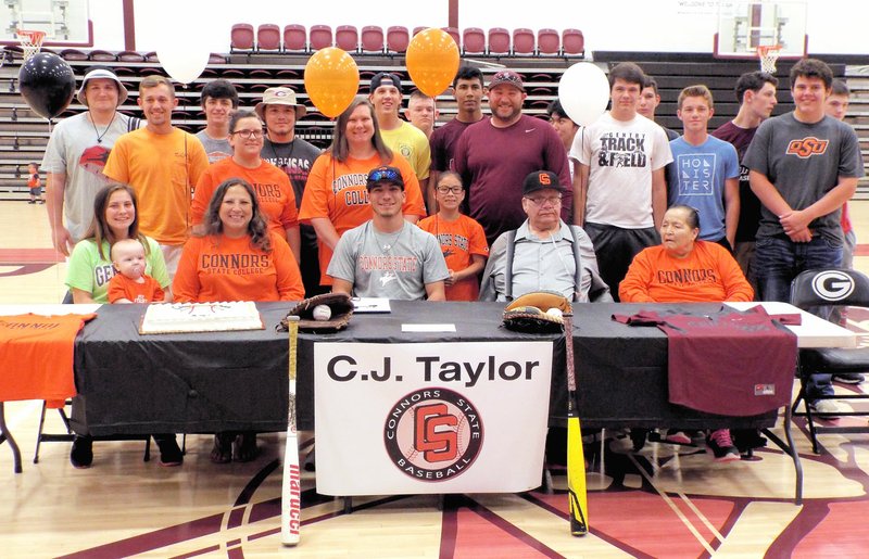 Photo by Randy Moll C.J. Taylor (center) signed a letter of intent May 11 at Gentry High School to play baseball at Connors State College in Warner, Okla. He was surrounded by Leona Taylor, his mother, Billi, his sister, with Brayden, Richard and Sharon Haag, his grandparents, Casey Bisbee, Aubrea Taylor, Jillia Taylor, Justin Ledbetter, his Gentry coach, teammates and classmates.