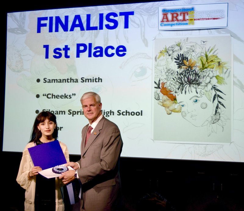 Photo submitted Samantha Smith, a junior at Siloam Springs High School, won first place in the Third Congressional District Art Competition. She was presented with her awards by Congressman Steve Womack during a ceremony on May 3.