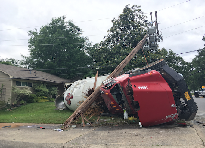 A concrete truck flipped Wednesday, May 18, 2016, near the intersection of Hawthorne and Pine Valley roads in Little Rock.