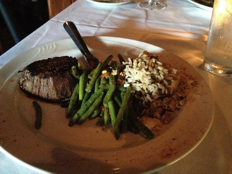 The steak — in this case, a 6-ounce filet with green beans and wild rice with walnuts on the side — is still seasoned “Sonny Style” at Sonny Williams’ Steak Room. 