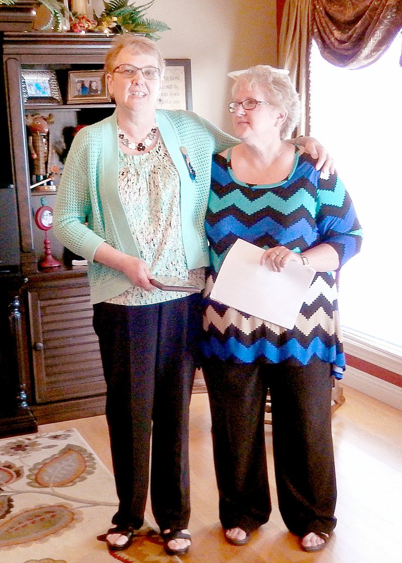 Photo submitted Following her program on changes in education, Alice Snodgrass, on left, surprises Mary Littlefield with the 2016 D.I.A.N.N.A. Award from Lambda Chi Chapter of ESA at a special meeting April 23.