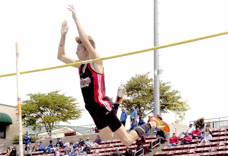 Photo by Rick Peck McDonald County&#8217;s Cole Cooper anxiously eyes his pole as it hits the crossbar following his attempt to clear 12-0 at Saturday&#x2019;s Class 4 District 6 Track and Field Championships at Branson High School. Though the pole hit the bar, it did not knock it off, meaning Cooper&#x2019;s successful vault earned him a trip to Saturday&#x2019;s sectional championships.
