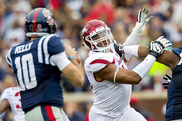 Arkansas defensive lineman Deatrich Wise tries to get to Ole Miss quarterback Chad Kelly on Saturday, Nov. 7, 2015, during the first quarter at Vaught-Hemingway Stadium in Oxford, Miss.