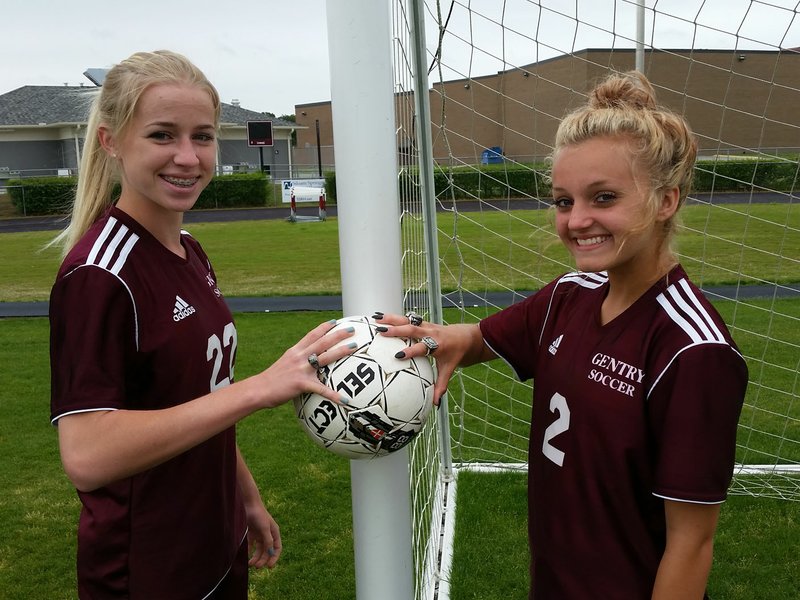 Amber Ellis (left) and Ana Linch have formed a potent 1-2 punch for the Gentry Lady Pioneers, the defending Class 4A state champions who will try to go back-to-back when they face Central Arkansas Christian at 2 p.m. Saturday at Razorback Field in a rematch of last year’s title match.