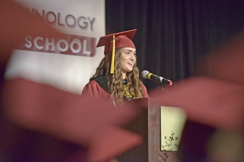 Hannah Katt, graduating with high honors, speaks Thursday during commencement for New Technology High School first graduating class at the John Q. Hammons Center in Rogers.