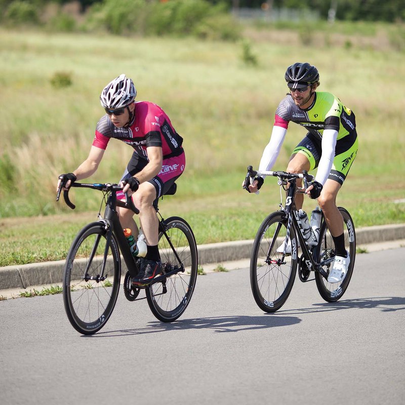 Kevin Solomon, left, and Ben Washburn near the finish line in the Mayor’s Youth Advisory Council Salt County Bike Tour in Bryant to benefit the Imagination 
Library on May 14.