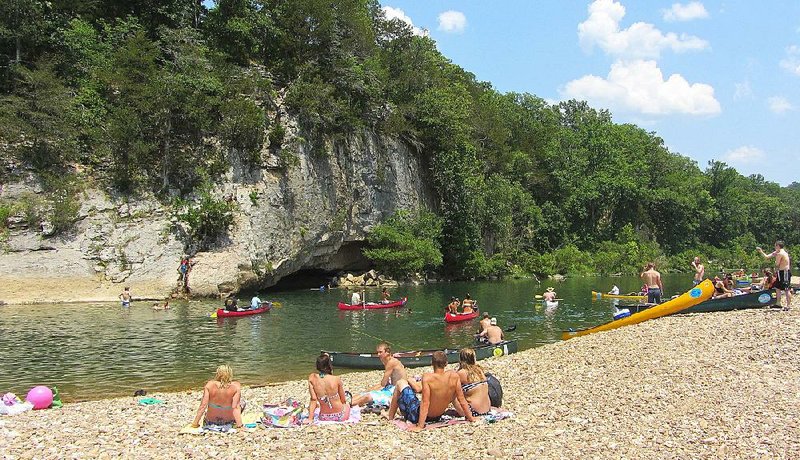 Swimming in settings backed by scenic cliffs is a popular summertime activity on Buffalo National River. 