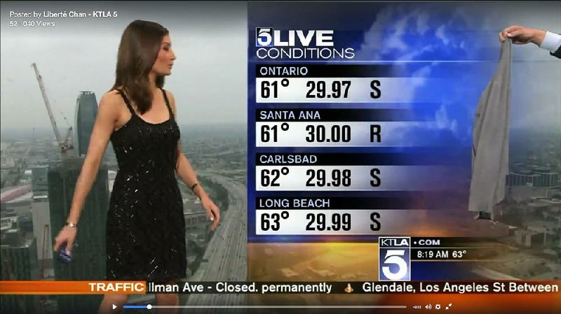 Cover up: This screen shot shows KTLA’s meteorologist Liberte Chan being handed a sweater by her co-worker. 