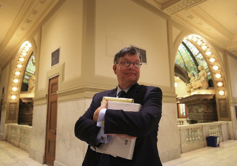 Little Rock City Attorney Tom Carpenter stands in the hall outside Judge Tim Fox's courtroom following a hearing Monday about why a $10,000 sanction against the city of Little Rock was not paid on time. 