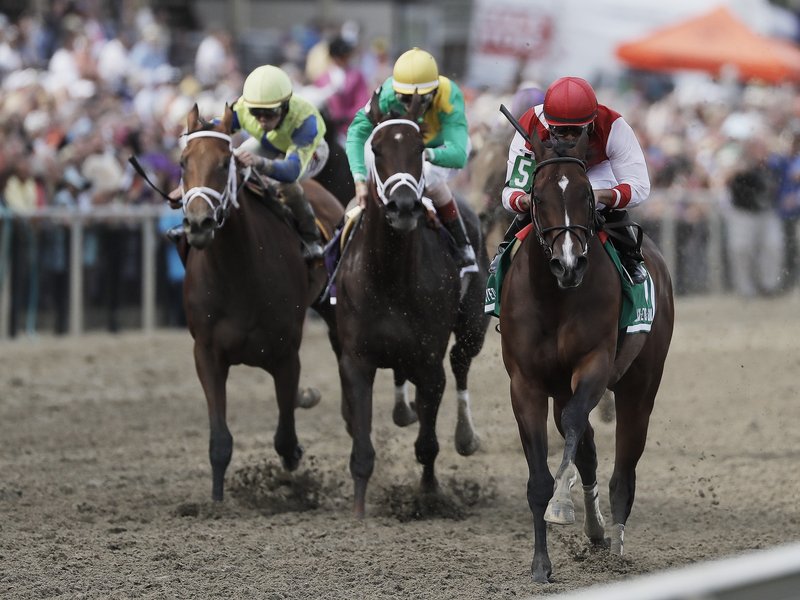 Go Maggie Go with Luis Saez aboard, right, wins the Black-Eyed Susan horse race at Pimlico Race Course as Kinsley Kisses with John Velazquez center and rider Brian Hernandez Jr. rides Ma Can Do It, come in Friday, May 20, 2016, in Baltimore. The 141st Preakness Stakes horse race runs Saturday, May 21. (AP Photo/Matt Slocum)