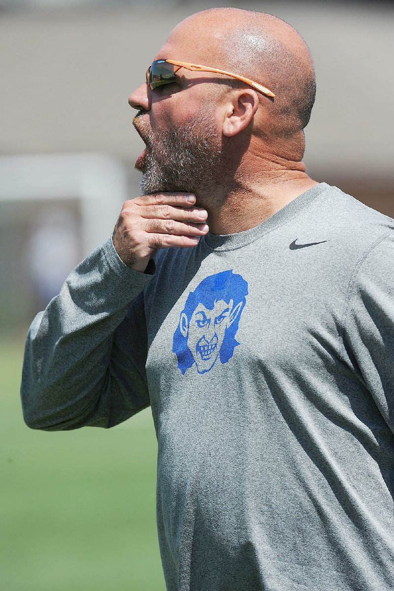 Harrison coach Chris Pratt directs his team against Pulaski Academy Saturday, May 21, 2016, during the Class 5A state championship game at Razorback Field in Fayetteville. 