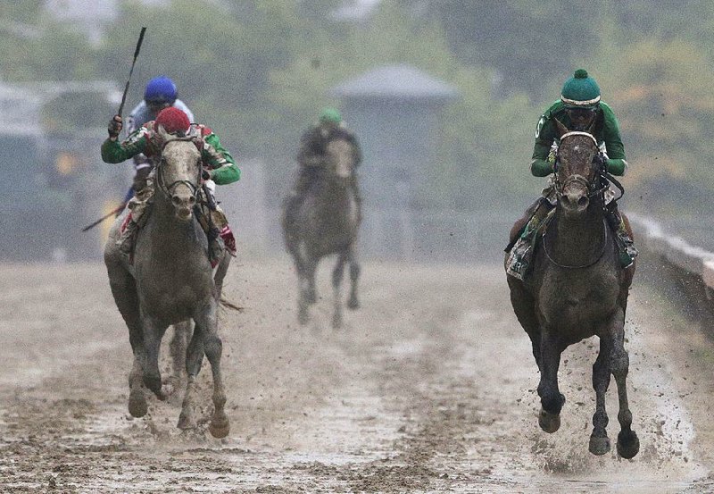Jockey Kent Desormeaux and Exaggerator (right) pull away from jockey Corey Lanerie and Cherry Wine to win the 141st Preakness Stakes on Saturday in Baltimore and put an end to a Triple Crown bid by third-place finisher Nyquist.