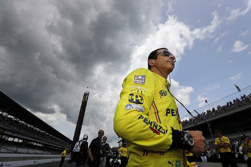 Helio Castroneves, fourth after the first day of qualifying for the Indianapolis 500, waits Saturday for his turn on the track. Drivers had to endure a 4½-hour wait before they were able to qualify.