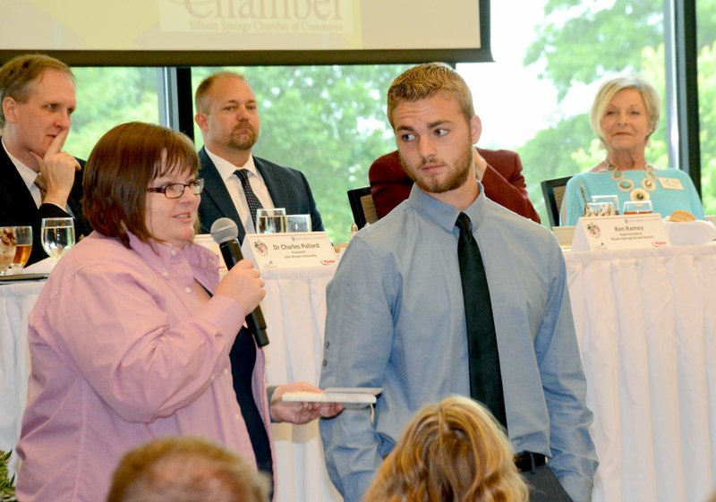 Janelle Jessen/Herald-Leader
K'dora Couch, plant manager at Webb Wheel, presented senior Nathanael Long during the 39th annual Chamber of Commerce Honor Graduate Luncheon on Thursday. A total of 21 high honor graduates and six honor graduates recognized during the event. A business sponsor introduced each senior and told about their achievements.