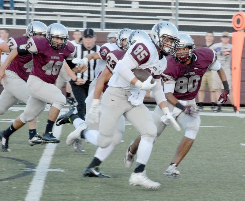 Graham Thomas/Siloam Sunday Siloam Springs rising senior Ty Trimble carried the ball in the first half for Siloam Springs White in the annual Maroon-White game held Friday at Panther Stadium. Maroon defeated White 14-12.