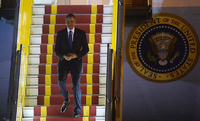 President Barack Obama arrives Sunday on Air Force One at Noi Bai International Airport in Hanoi, Vietnam. The president is on a weeklong trip to Asia.