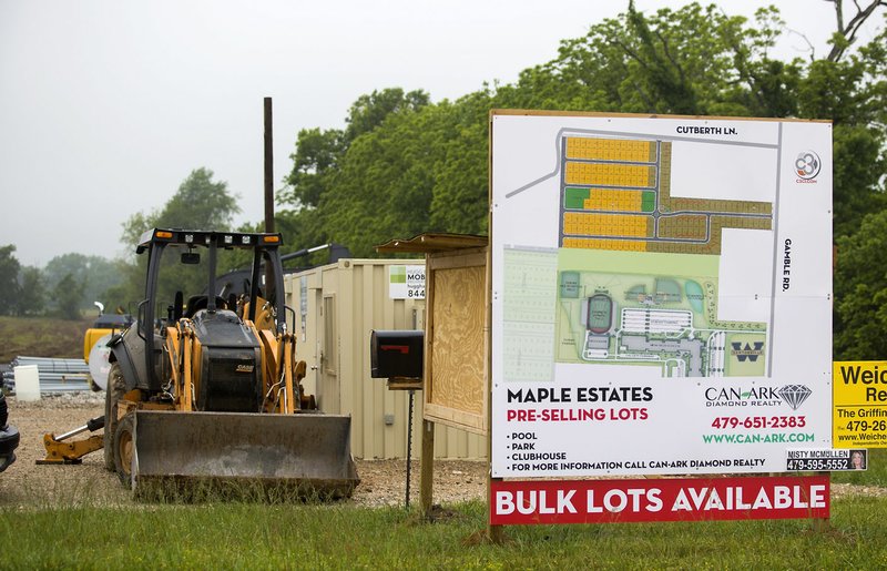 Early construction has begun on a new housing development, Maple Estates, on Tuesday on Gamble Road just north of the new Bentonville West High School in Centerton.