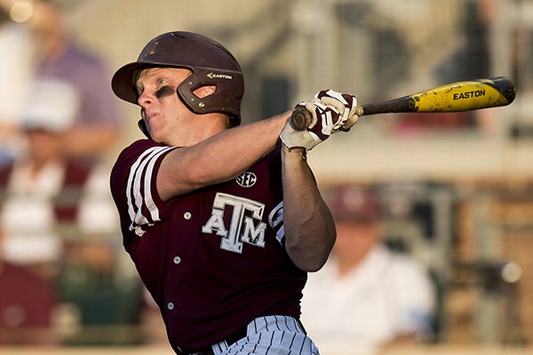 Texas A&M's Boomer White hits a home run off Mississippi pitcher David Parkinson during a college baseball game Friday, May 20, 2016, in College Station, Texas. (Timothy Hurst/Bryan-College Station Eagle via AP)