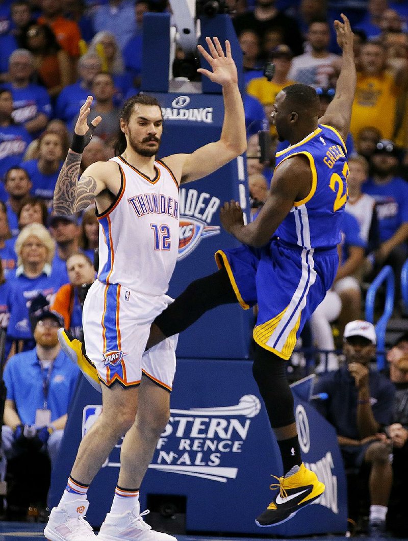 Golden State forward Draymond Green (right) avoided a suspension for kicking Oklahoma City’s Steven Adams in
the groin area during Sunday’s game. Instead, Green was fined $25,000 and had his foul upgraded to a flagrant 2.