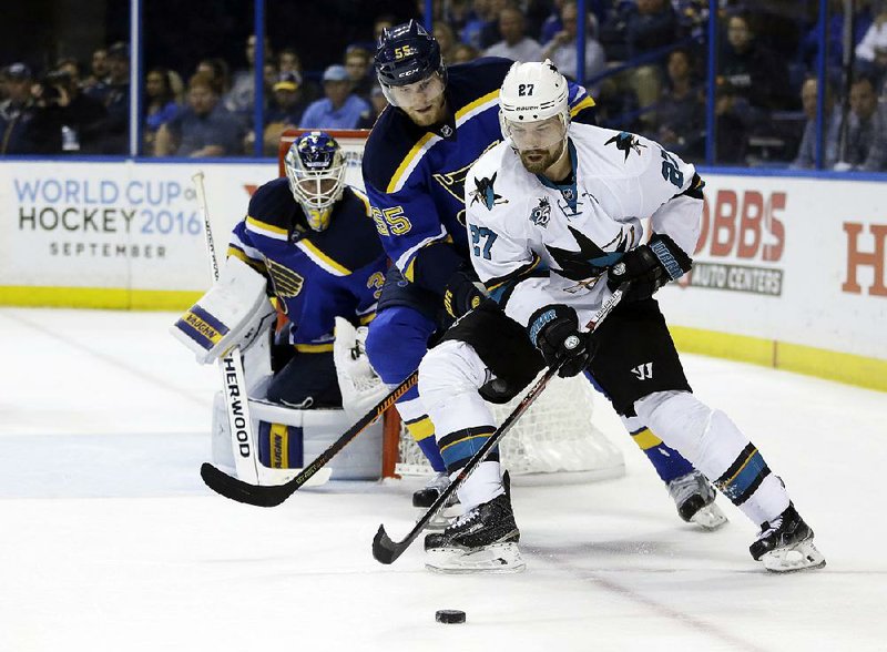 San Jose right wing Joonas Donskoi (right) controls the puck against St. Louis defenseman Colton Parayko during the third period in Game 5 of the NHL Western Conference final Monday. The Sharks scored three unanswered goals in the third period to beat the Blues 6-3.